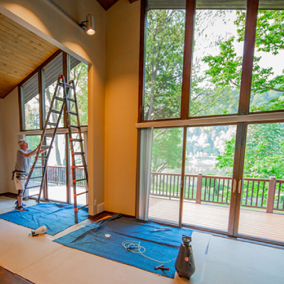 u.s. film crew worker installing residential window film