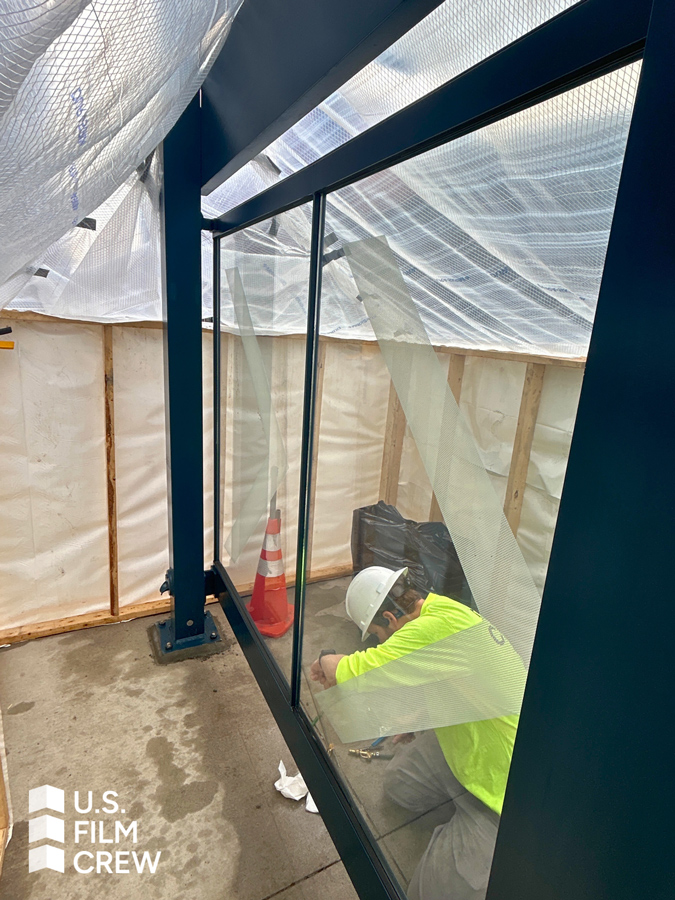 worker installing decorative film